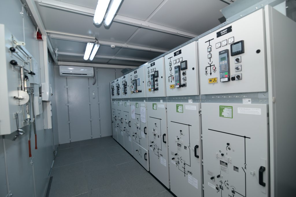 E-House interior with MV and LV switchgear lineup