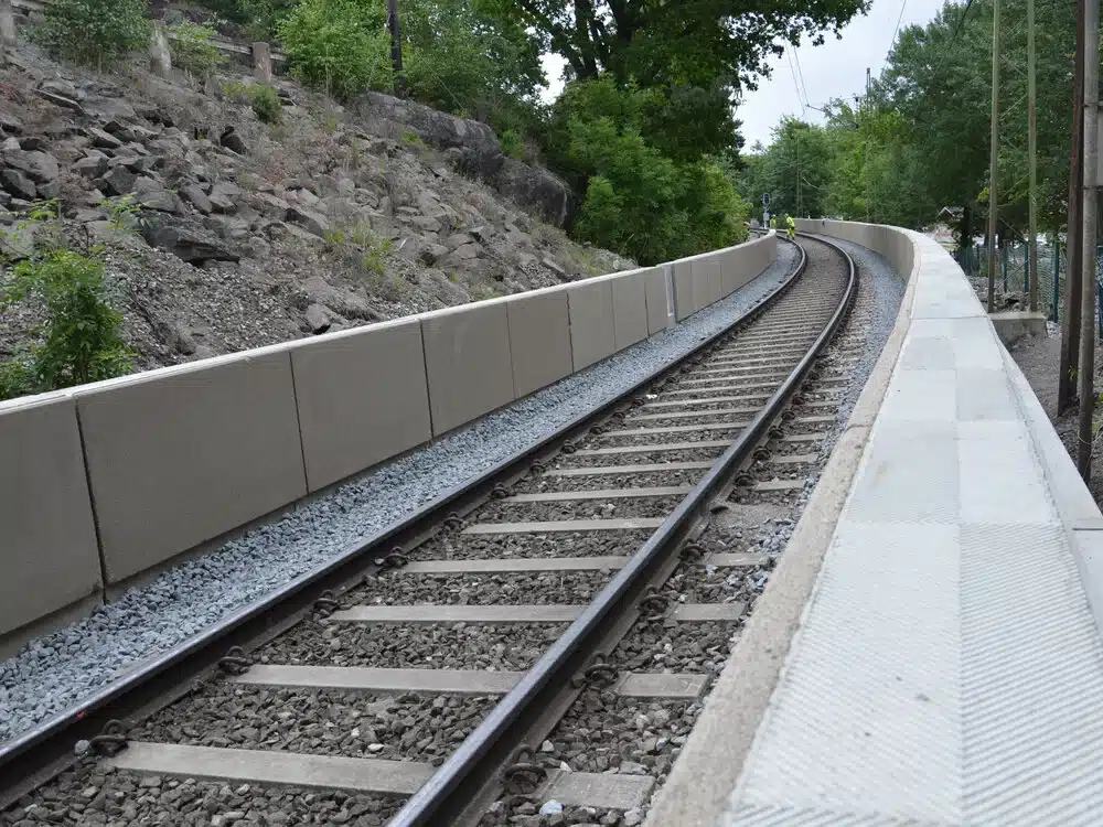 Concrete noise barrier walls installed along a railway corridor for traffic noise reduction