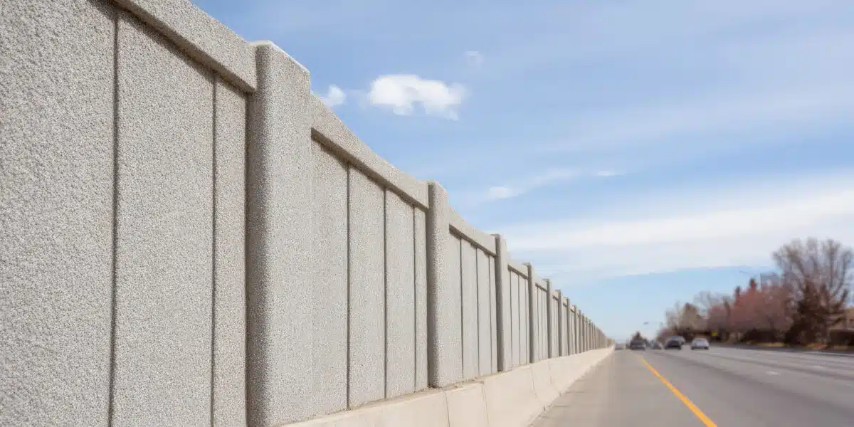 Close-up of a 100mm steel-reinforced precast concrete noise barrier panel face