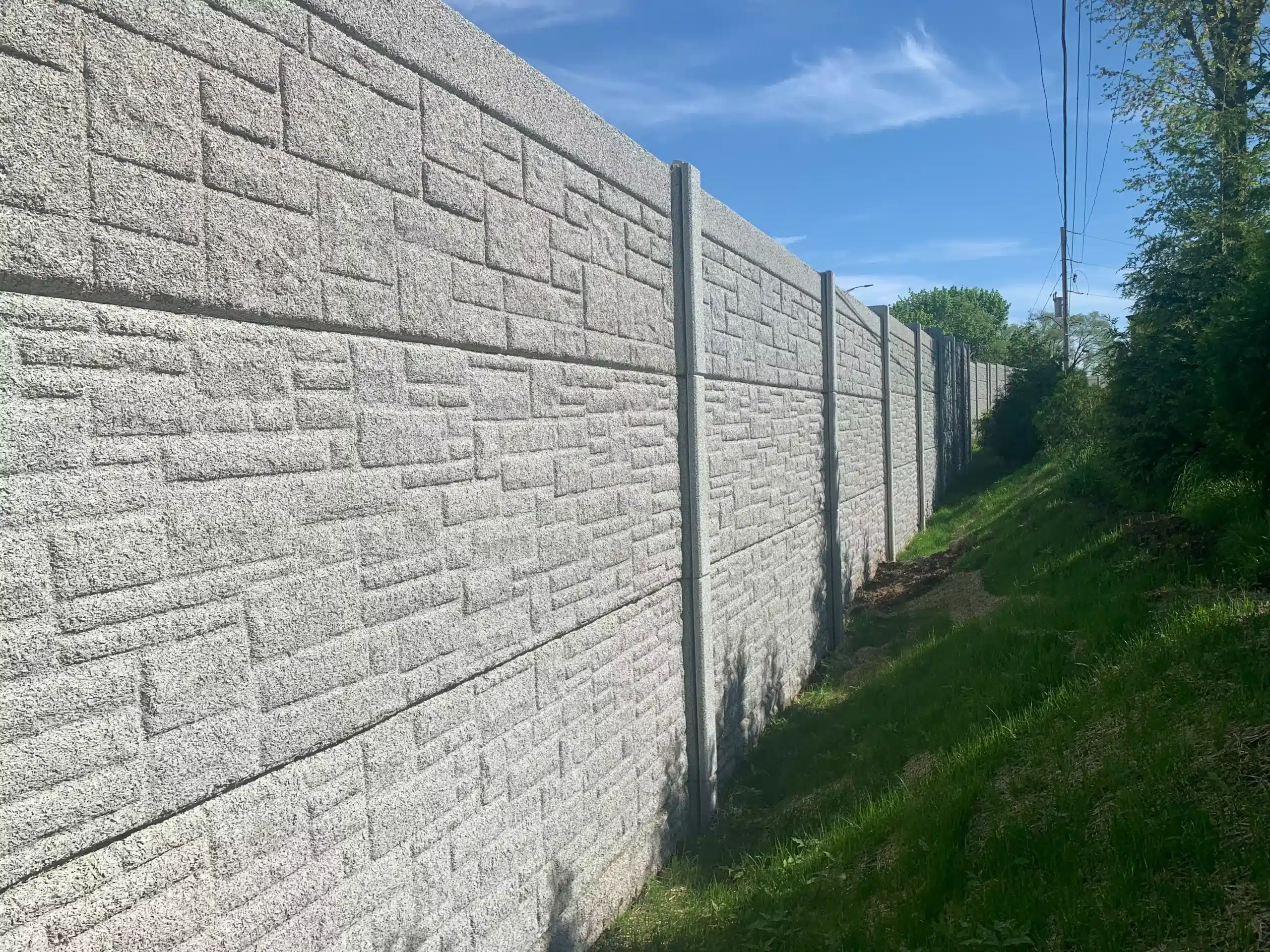 Precast concrete sound barrier walls installed along a highway by Ecotone